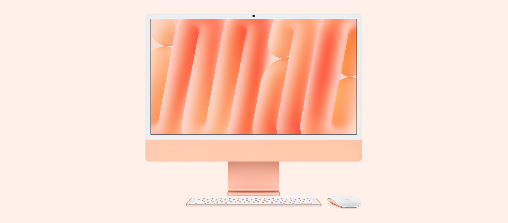 Vista frontal de un iMac naranjo con mouse y teclado a juego